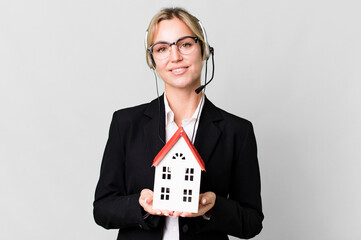 Wall Mural - pretty caucasian blonde businesswoman real state agent with headset