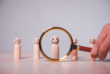 Aufkleber - Male hand using a magnifying glass to look for a smiling wood cube person