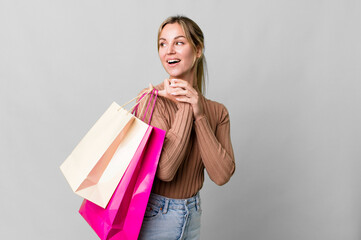 Wall Mural - pretty caucasian woman with shopping bags