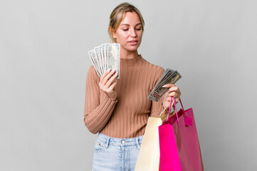 Wall Mural - pretty caucasian woman with shopping bags and dollar bills