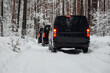 A Group of vans goes expedition at the snow forest
