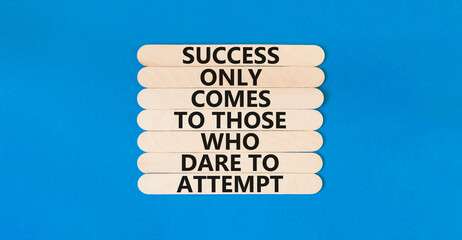 Success symbol. Concept words Success only comes to those who dare to attempt on wooden sticks. Beautiful blue table blue background copy space. Business success and attempt concept.