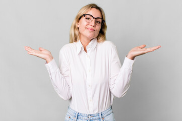 Wall Mural - caucasian blonde woman feeling puzzled and confused and doubting