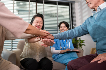 Wall Mural - Group of Asian senior people are given advice by professional self care psychologist  at elderly healthcare center, elder group therapy Geriatric consultation concept