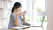 © Puwasit Inyavileart - Women are greeting friends and teachers through video chats and greeting them with cheerful expressions, Online communication , Stay home, New normal, VDO Call, Social distancing, Internet learning.