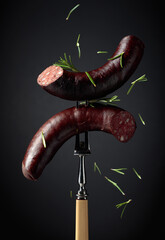 Wall Mural - Black pudding or blood sausage with rosemary.