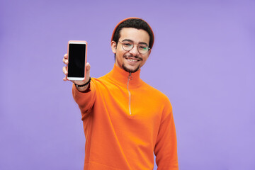 Aufkleber - Young cheerful man in casualwear showing smartphone with blank screen for your advert, sale announcement or other message