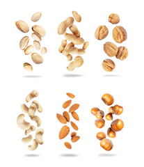 Poster - Set of various dried nuts close-up in the air isolated on a white background