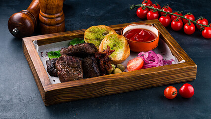 Wall Mural - Fried beef steak with marinated red onion, cherry tomatoes, olives, croutons and ketchup.