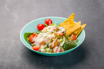 Wall Mural - salad caesar with shrimps on grey table