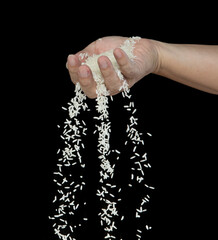 Wall Mural - Japanese Rice flying explosion, white grain rices explode abstract cloud fly. Beautiful complete seed rice splash in air, food object design. Selective focus freeze shot Black background isolated