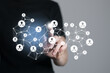 © mi_viri - Human resources manager pointing at virtual network chain with person icons. Human capital and teambuilding concept.
