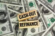 wooden board with the word CASH-OUT REFINANCE. the concept of getting money from refinancing