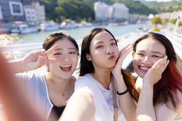 Now that the world is starting to travel for pleasure again,Three Asian girls go on a local trip in Kaohsiung, Taiwan