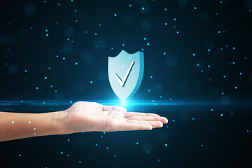 Fototapete - Close up of male hand holding creative antivirus shield icon on dark blue blurry bokeh circles background. Secure phone usage, protection and web safety concept.