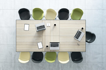 Aufkleber - Teamwork and brainstorm concept with top view on wooden conference table with laptops and coffee mugs surrounded by white, green and black chairs. 3D rendering