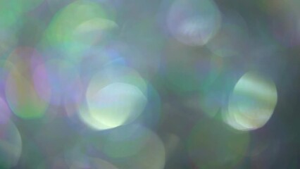 Wall Mural - Light Leaks Bokeh Overflow Transition With Fading. Abstract moving defocus. Beautiful round multicolor bokeh shimmers and shimmers. Backdrop, overlay or transition for composing your footage.
