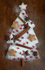 Sticker - Chocolate cookies on rustic wood table. Chocolate chip cookie on black background . Christmas pastry with candied fruits and cinnamon