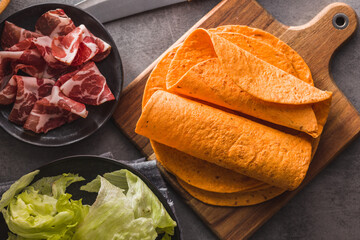 Wall Mural - Mexican Corn Tortillas on cutting board. Top view.