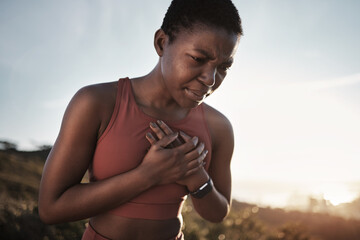 Black woman, runner and heart attack pain in nature while running outdoors. Sports, cardiovascular emergency and female athlete with chest pain, stroke or cardiac arrest after intense cardio workout.