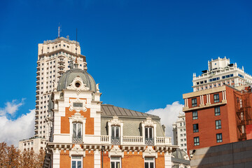 Wall Mural - Urban skyline in Plaza de Espana (Spain Square) with the beautiful building of the Belgian Royal Asturian Company of Mines, 1899, designed by Manuel Martinez Angel. Madrid downtown, Spain, Europe.