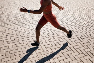 Wall Mural - Woman, fitness and running on brick street in sunshine for exercise, cardio workout and marathon training. Closeup legs of runner, athlete and energy with speed, power and action for outdoor sports