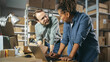 © Gorodenkoff - Happy Male and Female Working in Warehouse. Talking, Using Laptop Computer, Checking Retail Stock, Preparing Shipment. Successful Small Business Owners High Five Each Other.