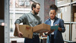 © Gorodenkoff - Female Inventory Manager Using Tablet Computer, Talking to a Worker Holding Two Cardboard Packages. They Discuss Customer Orders. Stock of Parcels with Products Ready for Shipment in the Background.