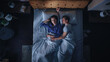 © Gorodenkoff - Top View Apartment: Happy Young Couple Side Cuddling Together in the Bed Sleeping at Night. Beautiful Girlfriend and Handsome Boyfriend Sleeping Together. Family of two Sweetly Embracing, Spooning