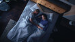 © Gorodenkoff - Top View Apartment: Happy Young Couple Sleeping in Bed at Night. Beautiful Girlfriend and Handsome Boyfriend Sleeping Together. Family of two Sweetly Sleeping Facing Each other.