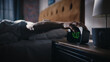 © Gorodenkoff - Man Wakes Up and Turns off Alarm Clock. Early Rising Productive Man Ready Start a Day full of New Adventures. Bedside Nightstand Focus on the Clock Showing Four O'Clock. Bedroom Apartment