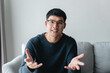 © Suriyawut - Young Asian man seriously explain talking on the couch. online video conference call, job interview, meeting.
