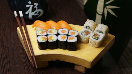 Wall Mural - Set of sushi with variety of makis, nigiris and sashimi with fine fish like salmon and tuna.