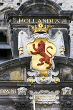 Close-up Of Decorative Gold Crowned Lion On Stone Building Front; Delft, South Holland, Netherlands