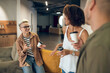 © zinkevych - Cheerful corporate worker talking to coworkers during the coffee break