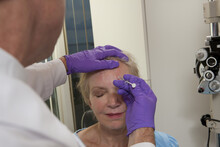 Ophthalmologist Giving A Botox Injection To A Patient