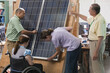 © Designpics - Engineering students examining photovoltaic panel's structural design and mounting