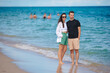 © travnikovstudio - Young couple on the beach vacation in Florida