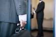 © Designpics - Businessman holding a briefcase.