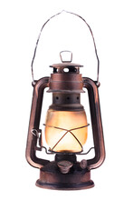Gas Lantern With Burning Light, Isolated On A White Background. An Antique Vintage Lamp. Hipster Accessory. Camping Light. Interior Decoration. Rusty, Covered With Patina. Wire Handle