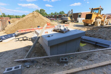 Electrical System Transformer Vault At Construction Site With Front End Loader And Excavator