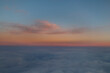© Designpics - Clouds glowing at sunset above the cloud cover viewed from an airline flight; Canada