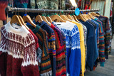 Fototapeta Londyn - London, UK - December 2nd, 2022. A temporary seasonal display of winter Christmas sweaters at a retail store.