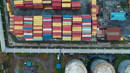 Wall Mural - Containers in cargo freight port, aerial top view from drone. Industrial harbor, global transportation and international logistic business concept.