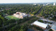 Aerial view over west Toronto, Ontario, Canada looking north-east over a football field and the train tracks that the Toronto transit subway travels between Islington and Royal York stations.