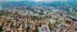 Aerial view around the capital city Sarajevo in Bosnia and Herzegovina on a cloudy and foggy day in autumn. 