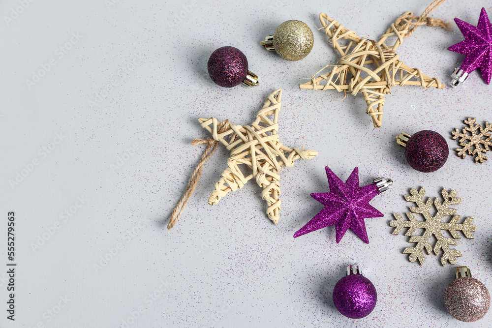 Set of different Christmas decorations on light background