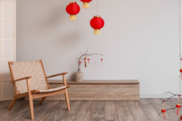 Interior of living room with armchair and decor for Chinese New Year celebration