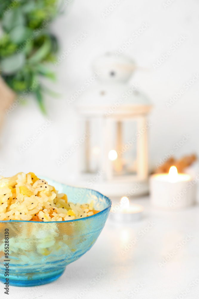 Bowl of rice Kutya on white table, closeup