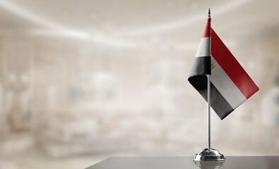 A small Egypt flag on an abstract blurry background